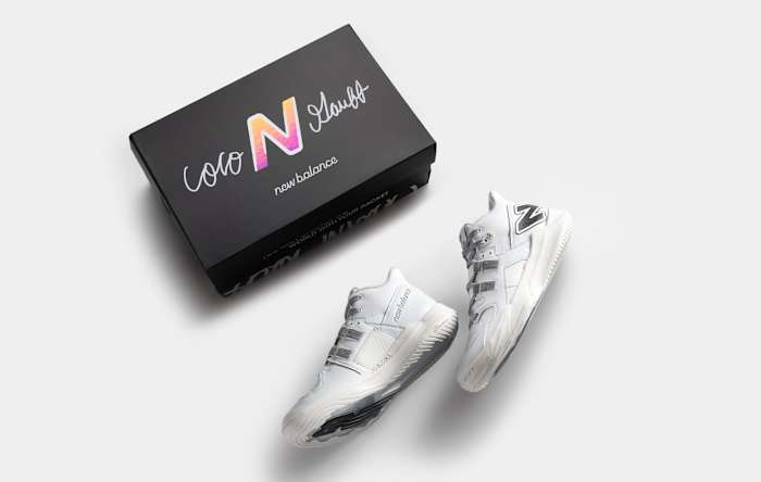 Coco Gauff's white and black New Balance tennis shoes and box.